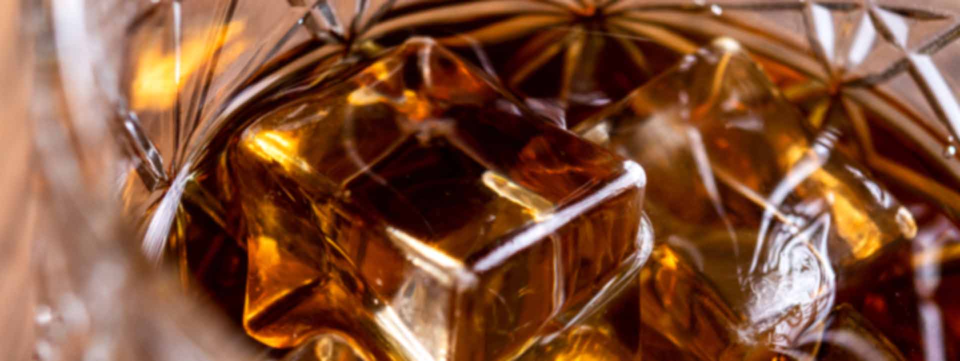 whiskey glass wooden table close-up